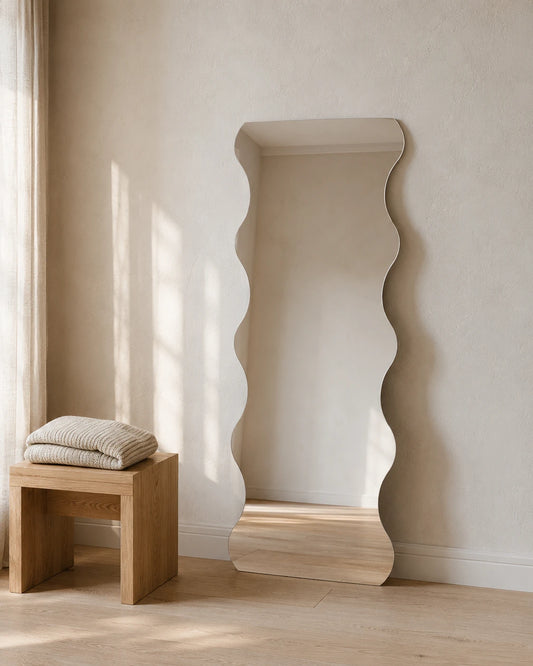 Felicia wave full length mirror leaning beside a timber stool