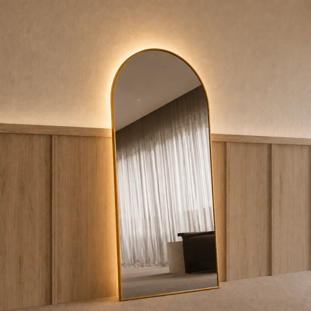 Sienna Copper LED Arch Mirror 1800 x 850, angled left view, Antique Copper frame with the backlight glowing
