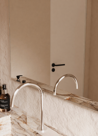 Vittoria frameless arch mirror polished edge detail, close up