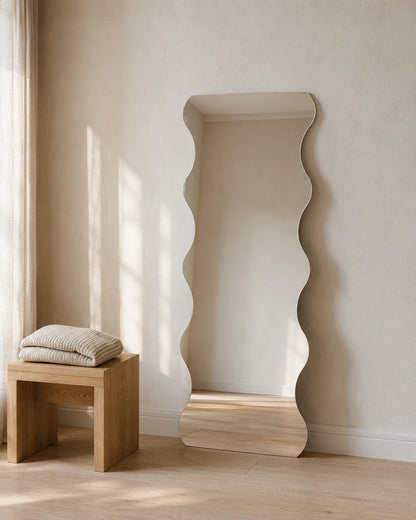 Felicia wave full length mirror leaning beside a timber stool