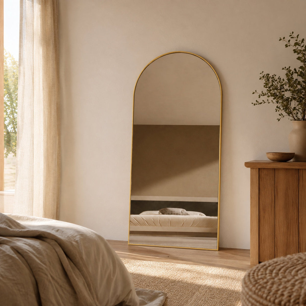 Sienna Framed Arch Mirror - 1800 x 850 in Brushed Gold, styled in a room