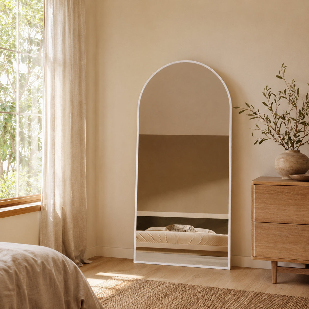 Sienna Framed Arch Mirror - 1800 x 850 in White Satin, styled in a room
