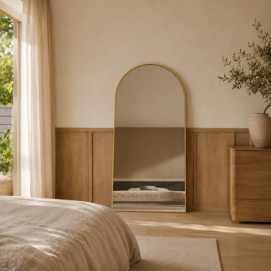 Sienna Framed Arch Mirror - 2000 x 1100 in Brushed Gold, styled in a room