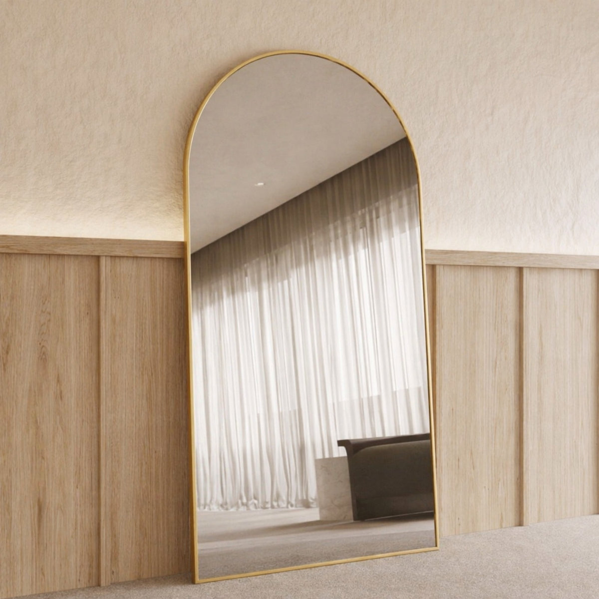 Sienna Framed Arch Mirror - 2000 x 1100 in Brushed Gold, angled from the left